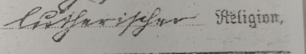 A line from an old document showing one handwritten word in Kurrent script, quite neatly written, and one printed word "Religion" in an oldfashioned type.
